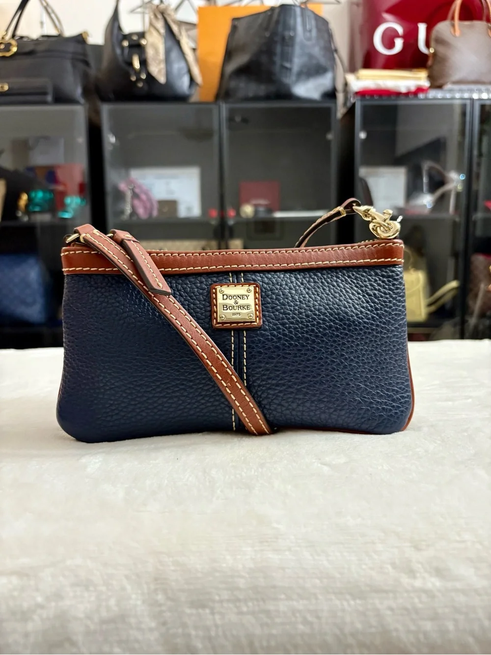 Dooney & Bourke Large Slim Cell Phone Wristlet – Navy Blue Pebble Grain Leather.